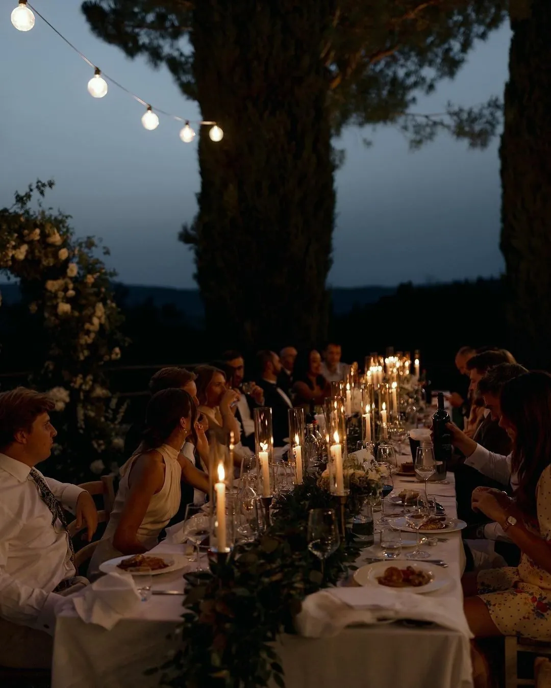 A table set and lit before service, the room still empty